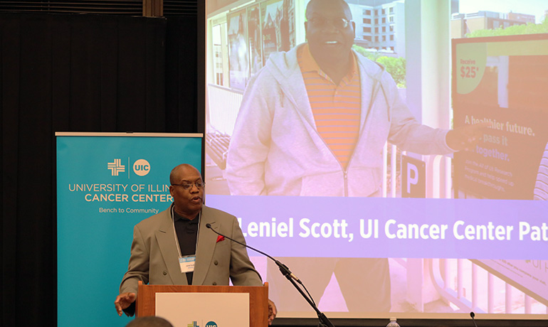 Leniel Scott speaking in a UI Cancer Center Seminar.