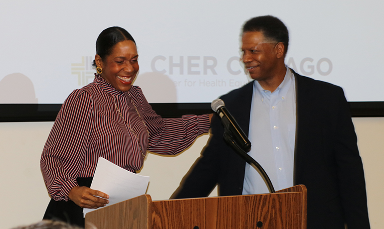 Dr. Winn and a woman guest speaking on CHER Chicago Seminar.