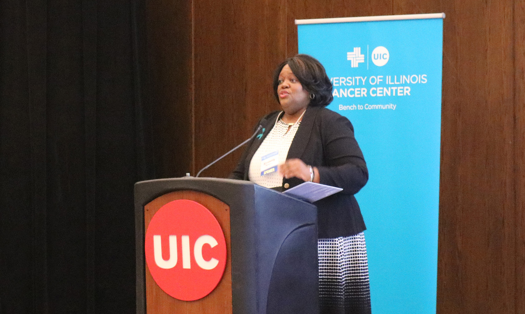 Kimberly Richardson speaking on a UIC podium.