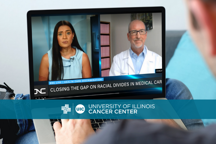 Dr. Kent Hoskins' video clip on a laptop with the cancer center logo