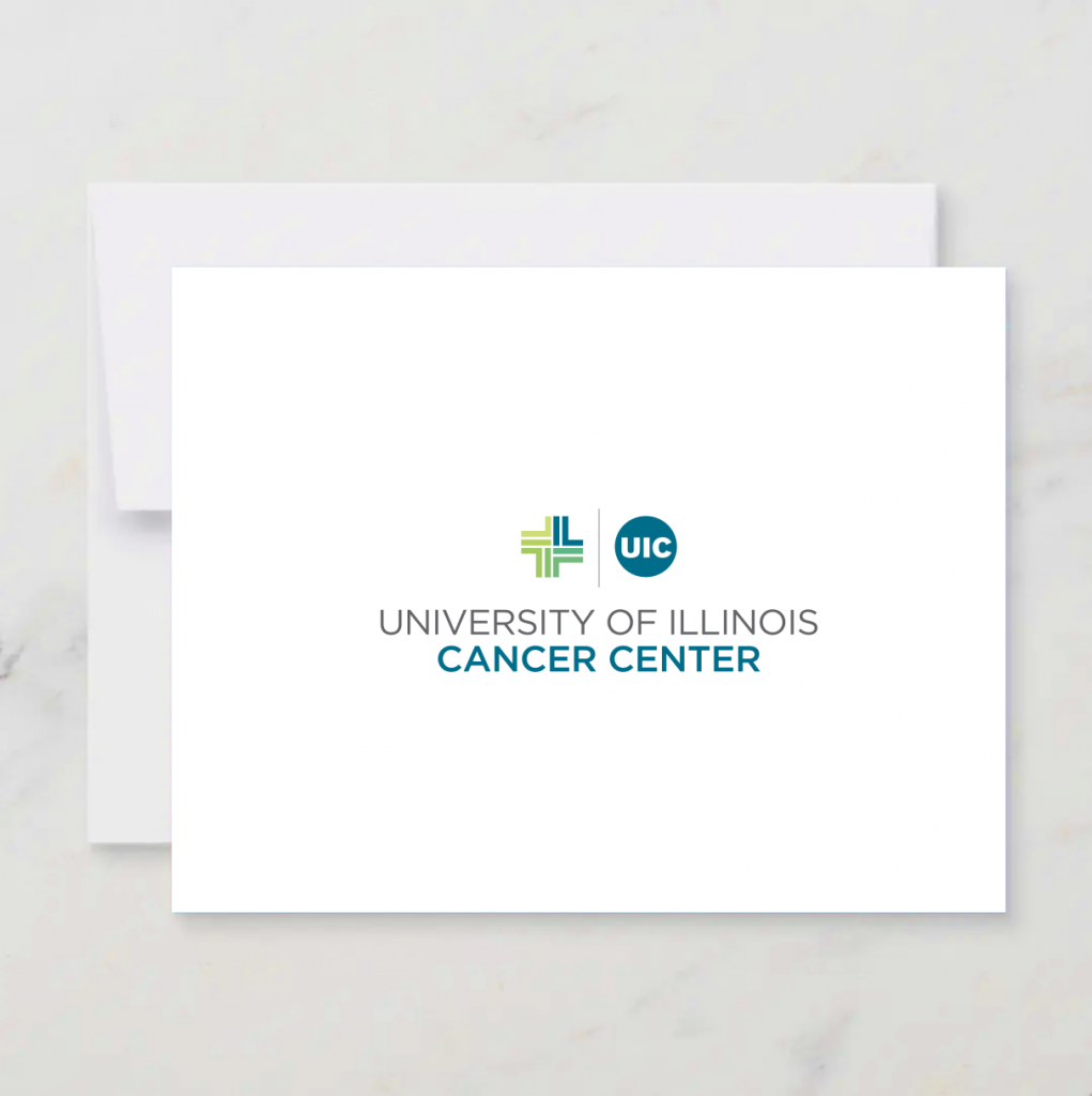 White notecard and envelope with Cancer Center logo in color